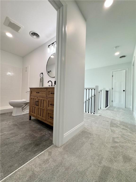 4 Brookwood Hills Dr, Big Flats, NY 14845 - full bath with vanity, toilet, a shower, baseboards, and carpet floors