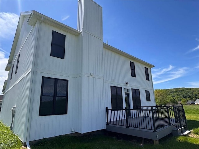 4 Brookwood Hills Dr, Big Flats, NY 14845 - rear view of house with a deck