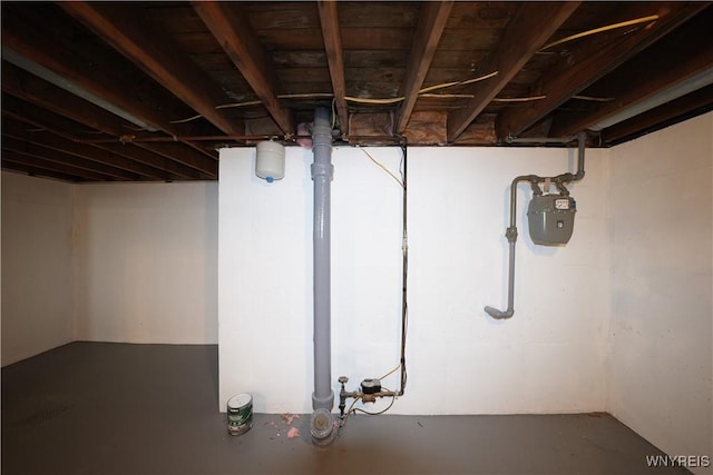unfinished basement with gas meter