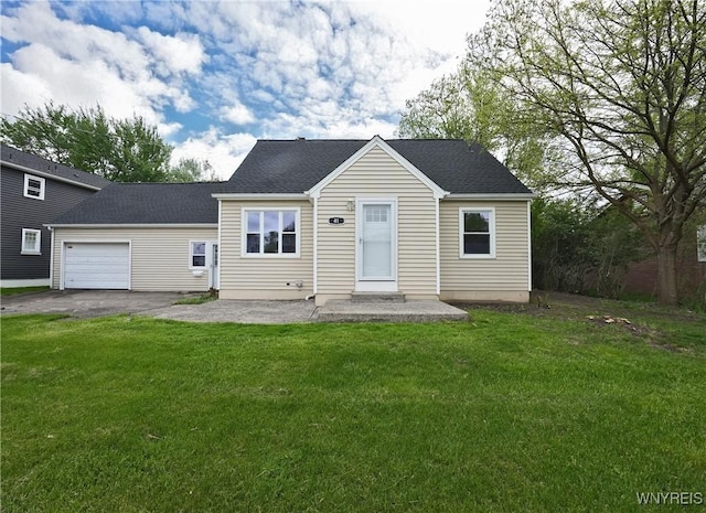 view of front of home with an attached garage, a front yard, asphalt driveway, and roof with shingles