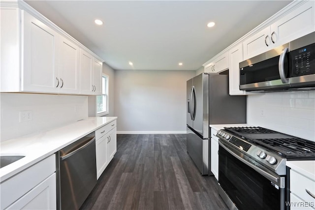 kitchen with appliances with stainless steel finishes, white cabinets, decorative backsplash, light countertops, and recessed lighting