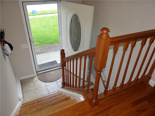 129 Daffodil Dr, Horseheads, NY 14845 - entrance foyer featuring baseboards, stairs, and tile patterned flooring