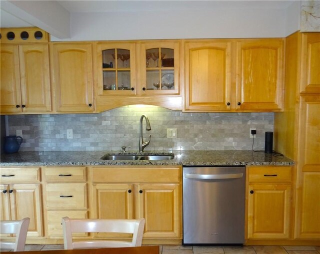 129 Daffodil Dr, Horseheads, NY 14845 - kitchen with dishwasher, a sink, decorative backsplash, and dark stone countertops