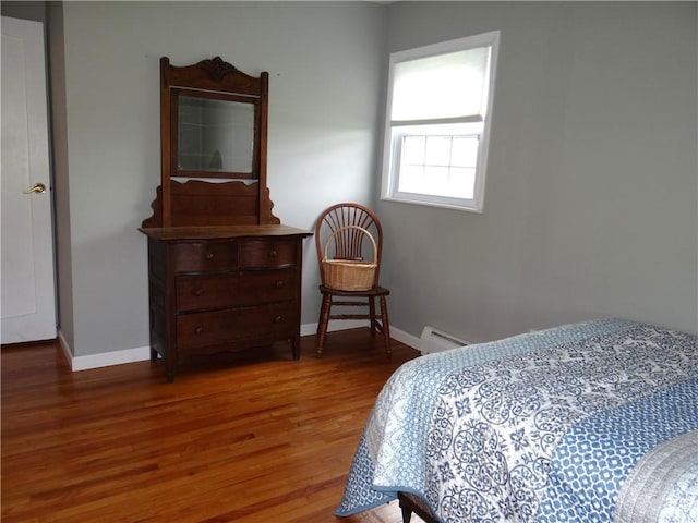 129 Daffodil Dr, Horseheads, NY 14845 - bedroom with a baseboard heating unit, wood finished floors, and baseboards