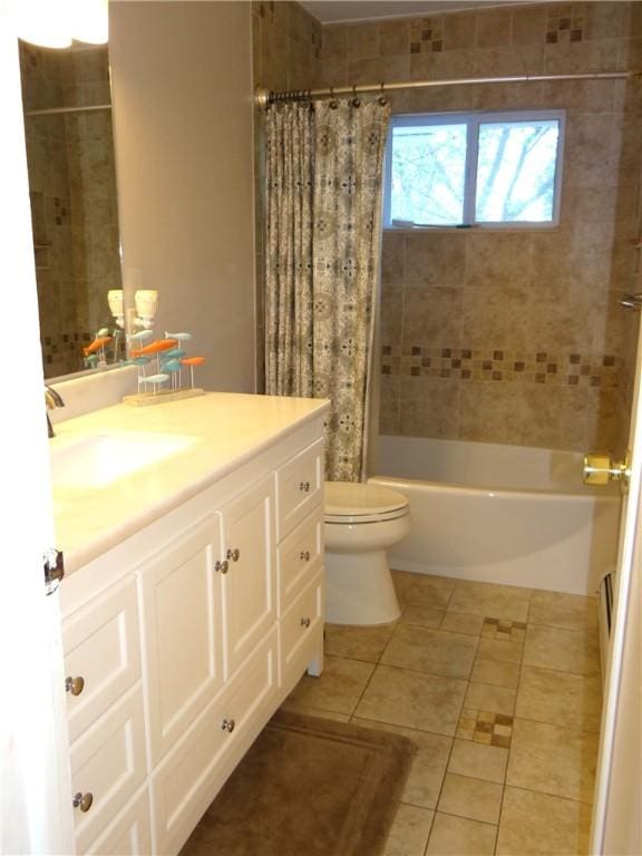 129 Daffodil Dr, Horseheads, NY 14845 - bathroom featuring tile patterned floors, toilet, shower / tub combo with curtain, and vanity