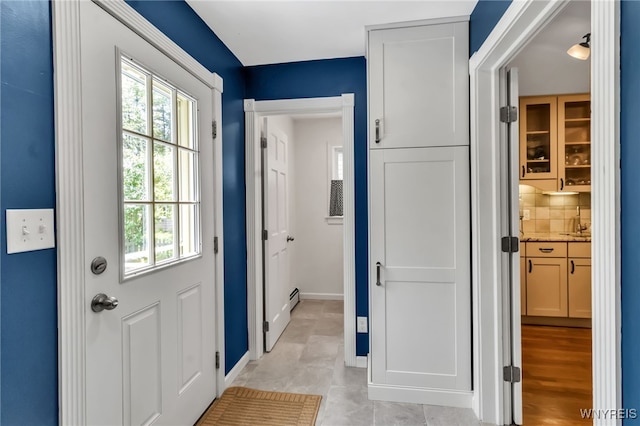 doorway with baseboards