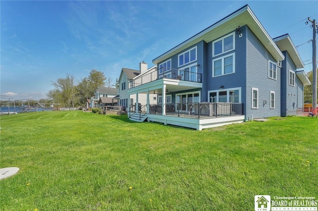 5518 Wells Bay Lakefront, North Harmony, NY 14710 - rear view of house featuring a lawn, a wooden deck, and a balcony
