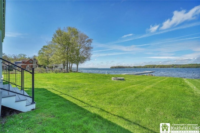5518 Wells Bay Lakefront, North Harmony, NY 14710 - view of green lawn featuring a water view and stairs