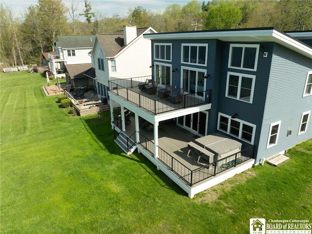 5518 Wells Bay Lakefront, North Harmony, NY 14710 - rear view of house with a wooden deck and a yard