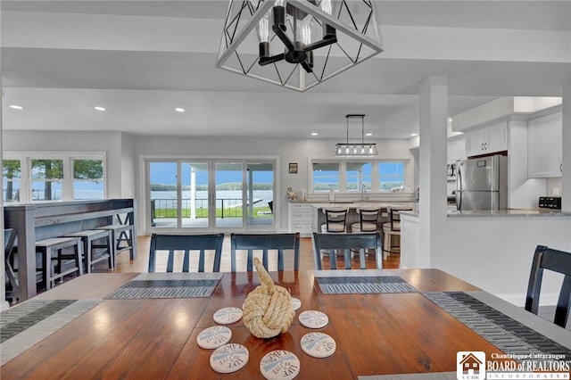 5518 Wells Bay Lakefront, North Harmony, NY 14710 - dining space with recessed lighting, plenty of natural light, a chandelier, and light wood finished floors