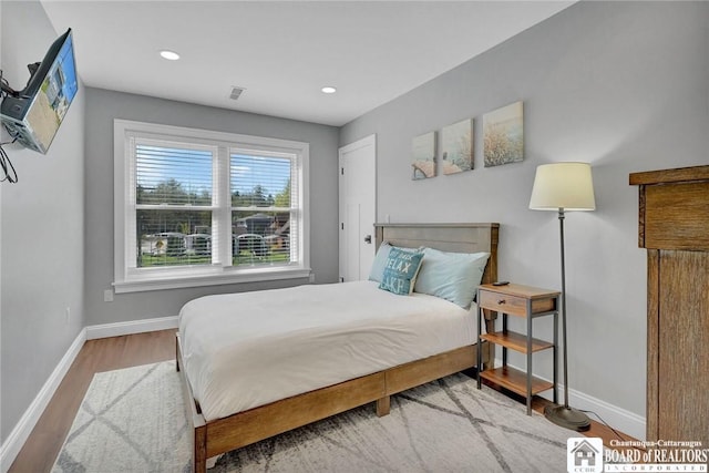 5518 Wells Bay Lakefront, North Harmony, NY 14710 - bedroom with baseboards, wood finished floors, and recessed lighting