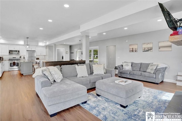 5518 Wells Bay Lakefront, North Harmony, NY 14710 - living room with light wood-type flooring, recessed lighting, and baseboards