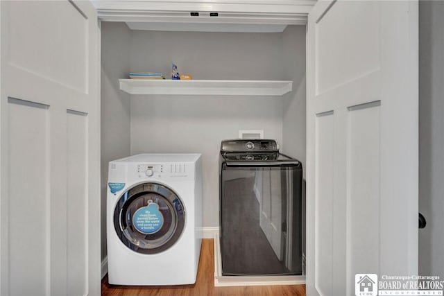 5518 Wells Bay Lakefront, North Harmony, NY 14710 - clothes washing area featuring separate washer and dryer and wood finished floors