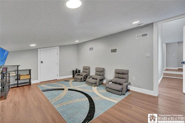 5518 Wells Bay Lakefront, North Harmony, NY 14710 - living area with wood finished floors, baseboards, and recessed lighting
