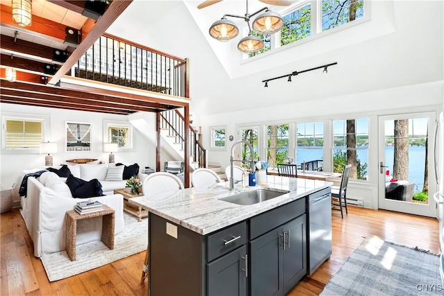 2330 Thornton S, Skaneateles, NY 13152 - kitchen with a sink, track lighting, stainless steel dishwasher, open floor plan, and high vaulted ceiling