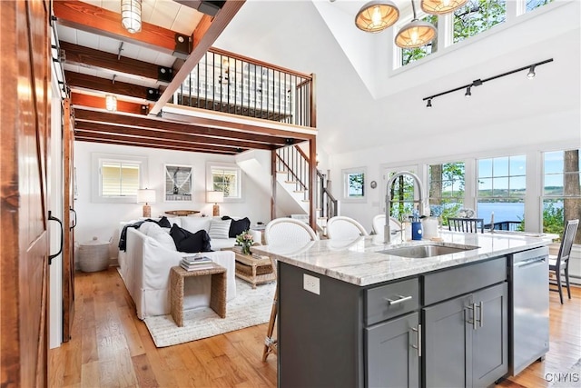 2330 Thornton S, Skaneateles, NY 13152 - kitchen with gray cabinetry, a sink, rail lighting, a high ceiling, and open floor plan