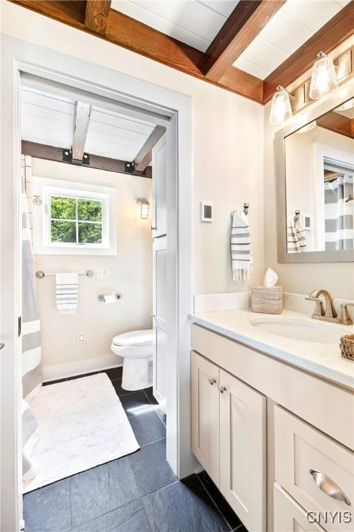 2330 Thornton S, Skaneateles, NY 13152 - bathroom featuring beam ceiling, tile patterned flooring, toilet, and vanity