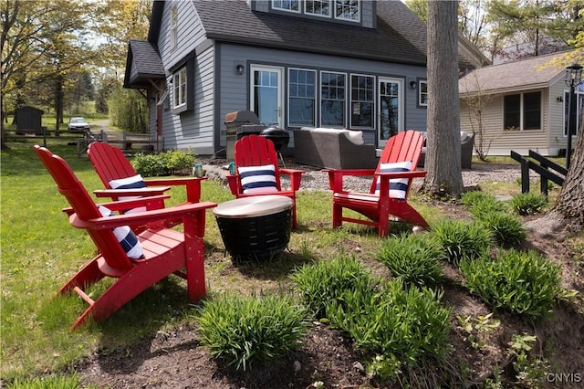 2330 Thornton S, Skaneateles, NY 13152 - back of property with a lawn, an outdoor hangout area, and a shingled roof