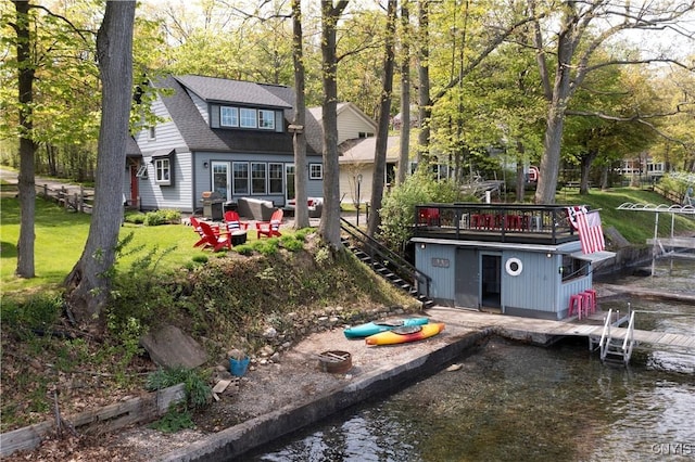2330 Thornton S, Skaneateles, NY 13152 - back of property with stairs, a deck with water view, and a shingled roof