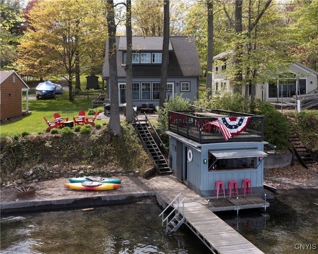 2330 Thornton S, Skaneateles, NY 13152 - rear view of property with stairway, an outdoor fire pit, and a deck with water view
