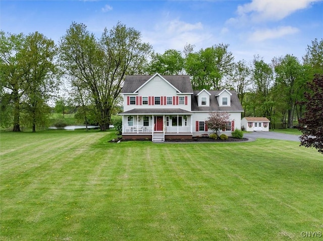 101 Pinehurst Ln, Augusta, NY 13425 - rear view of property featuring covered porch, a yard, and driveway