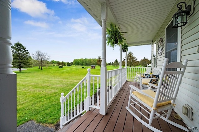 101 Pinehurst Ln, Augusta, NY 13425 - wooden deck featuring covered porch and a yard