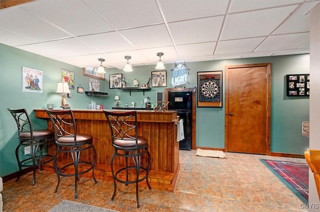101 Pinehurst Ln, Augusta, NY 13425 - indoor wet bar featuring a drop ceiling, freestanding refrigerator, and baseboards
