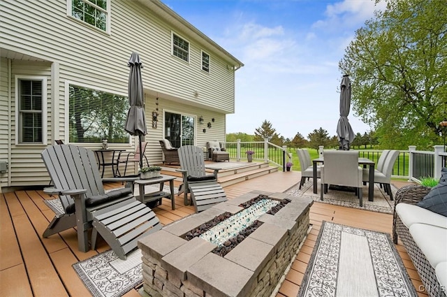 101 Pinehurst Ln, Augusta, NY 13425 - wooden terrace featuring outdoor dining area and an outdoor living space with a fire pit