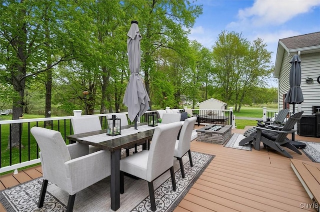 101 Pinehurst Ln, Augusta, NY 13425 - deck with outdoor dining area and a fire pit