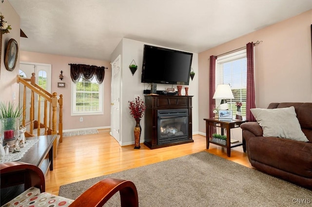 101 Pinehurst Ln, Augusta, NY 13425 - living room with light wood-style flooring, a glass covered fireplace, and baseboards