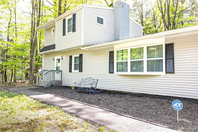 view of side of property featuring a chimney