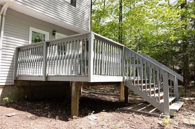 wooden deck featuring stairs