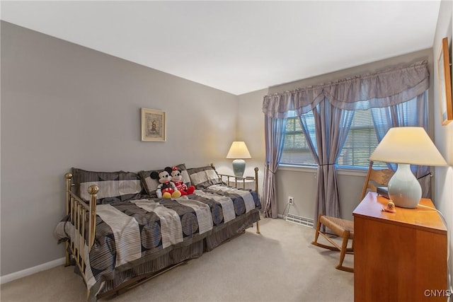 bedroom featuring carpet and baseboards