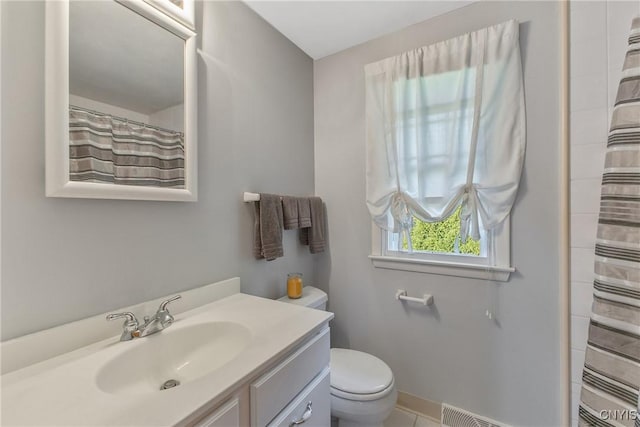 bathroom with toilet, vanity, baseboards, a shower with curtain, and tile patterned flooring