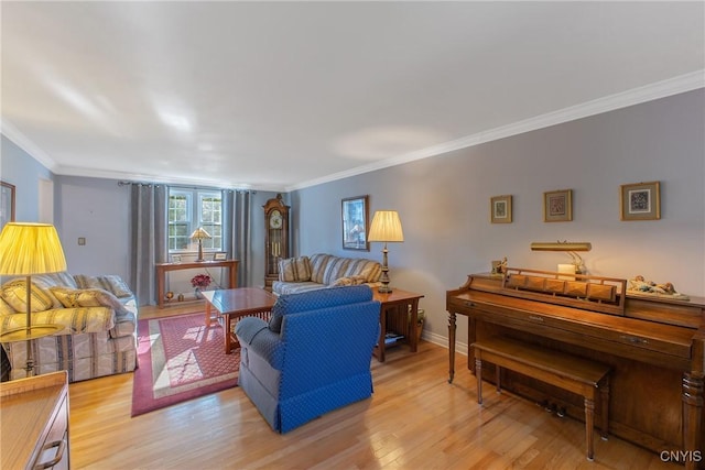 living area with wood finished floors and crown molding