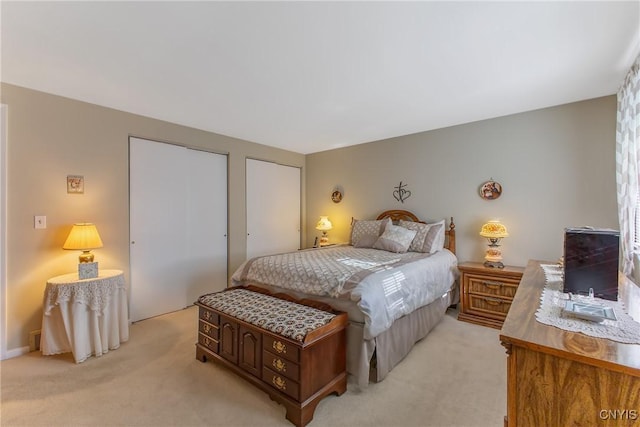 bedroom featuring light colored carpet
