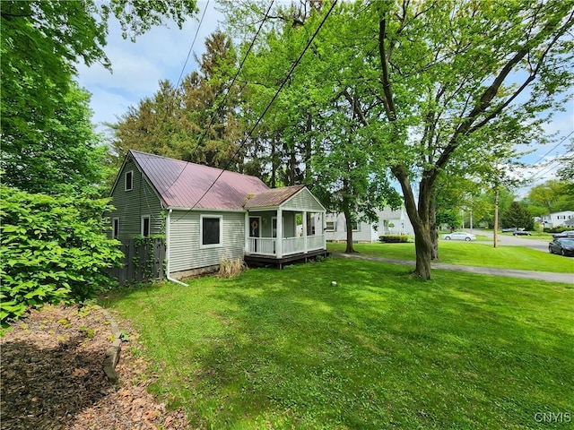 view of front facade featuring covered porch and metal roof