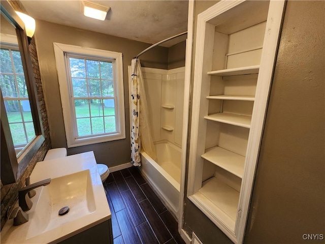 full bathroom with baseboards, wood finished floors, vanity, toilet, and shower / bath combination with curtain