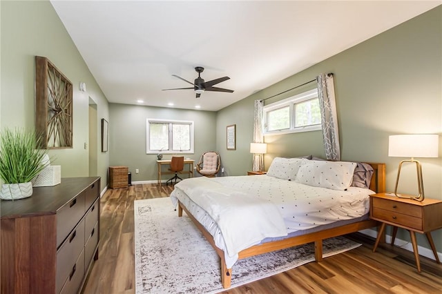 bedroom with multiple windows, wood finished floors, baseboards, recessed lighting, and a ceiling fan