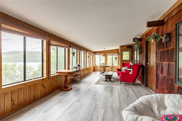 sunroom / solarium with wood walls and wood finished floors