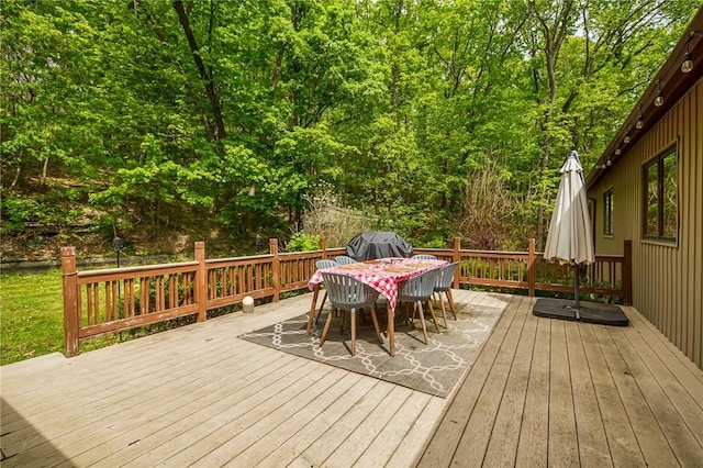 deck featuring outdoor dining area