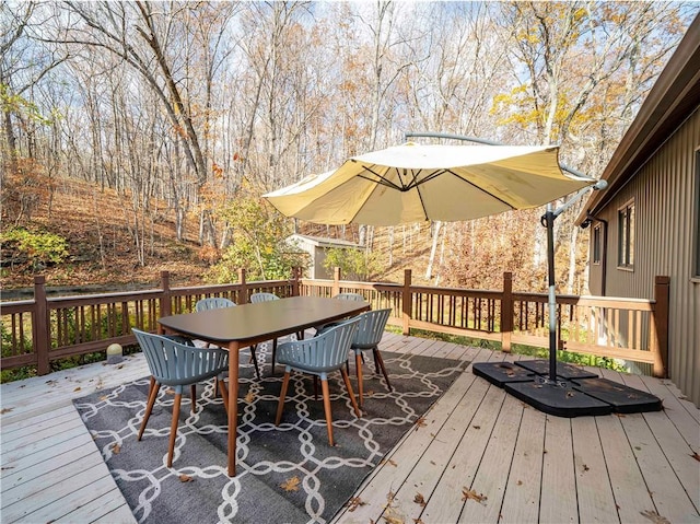 deck with outdoor dining area