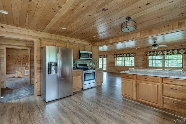 7278 Martin Dr, Leyden, NY 13309 - kitchen featuring stainless steel appliances, wood ceiling, wood walls, light wood finished floors, and ceiling fan
