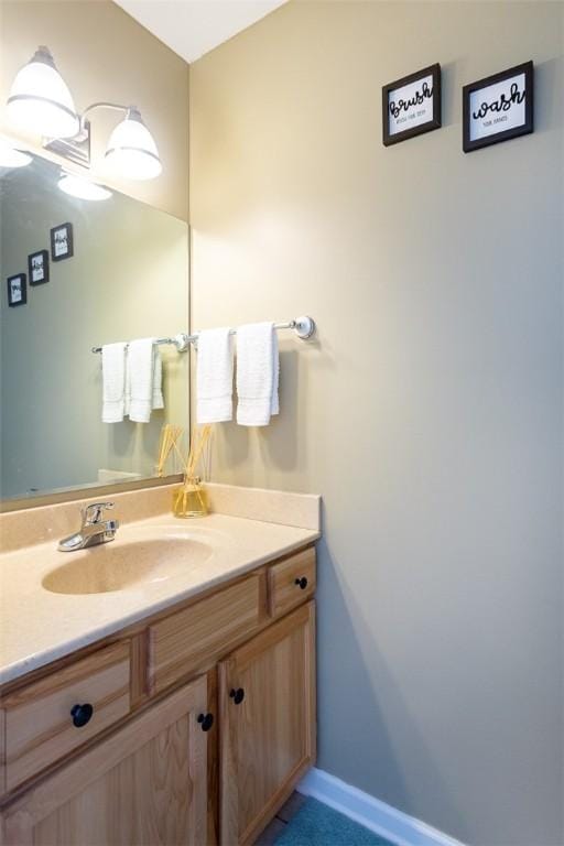 13 Hawthorn Cir, Geneseo, NY 14454 - bathroom with vanity and baseboards