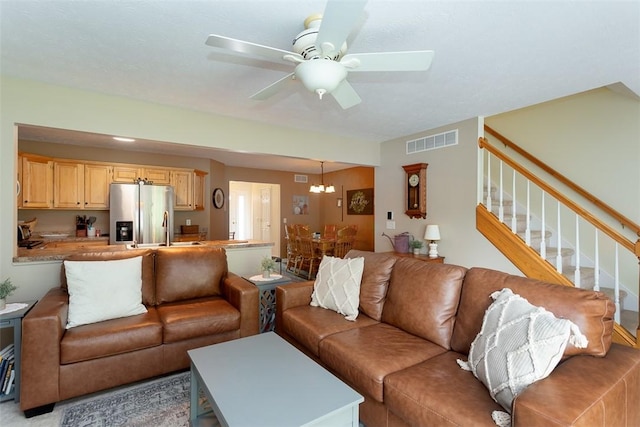 13 Hawthorn Cir, Geneseo, NY 14454 - living area featuring stairway, ceiling fan, and a chandelier