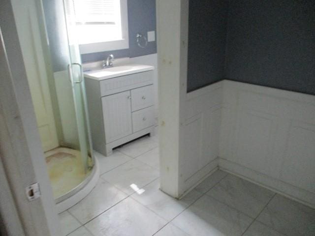 4 Main St, Barton, NY 14859 - full bath featuring wainscoting, a shower stall, vanity, and a decorative wall