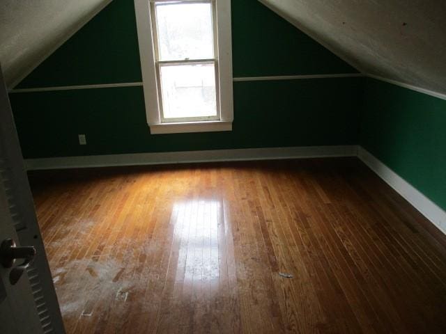 4 Main St, Barton, NY 14859 - bonus room featuring lofted ceiling, wood-type flooring, and baseboards
