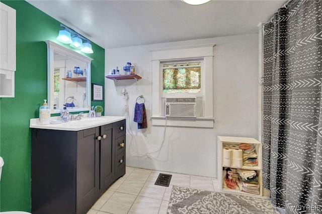full bath with tile patterned flooring, cooling unit, vanity, and a shower with shower curtain