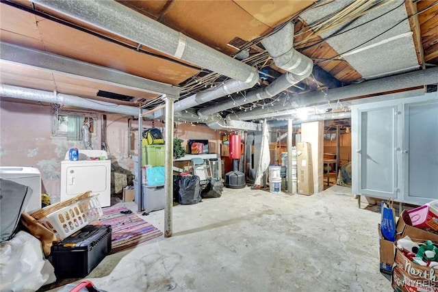 unfinished basement featuring washer and dryer