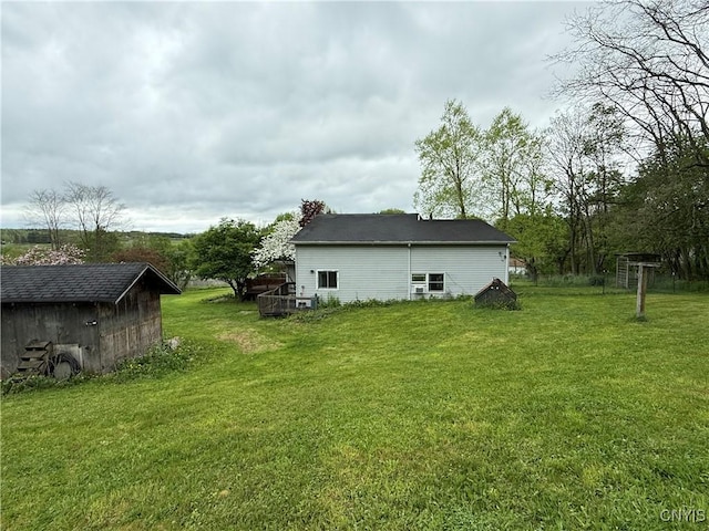 62 Pleasant Valley Rd, Groton, NY 13073 - rear view of property featuring an outbuilding, a lawn, and a storage shed